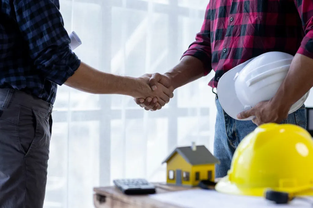 Contractor shaking hands with homeowner